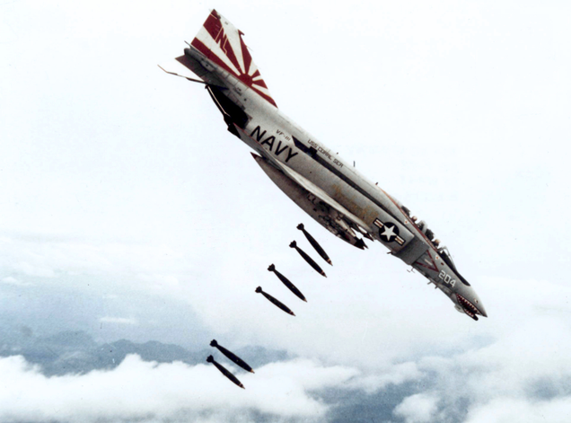 Anl F-4B Phantom II of US Navy Fighter Squadron VF-111 Sundowners on a bombing mission over Vietnam in 1971. (US Air Force)
